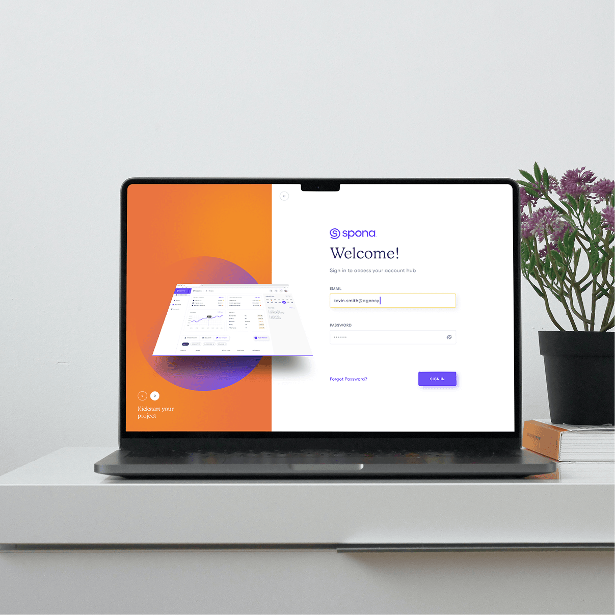 Spona login screen with welcome message on laptop